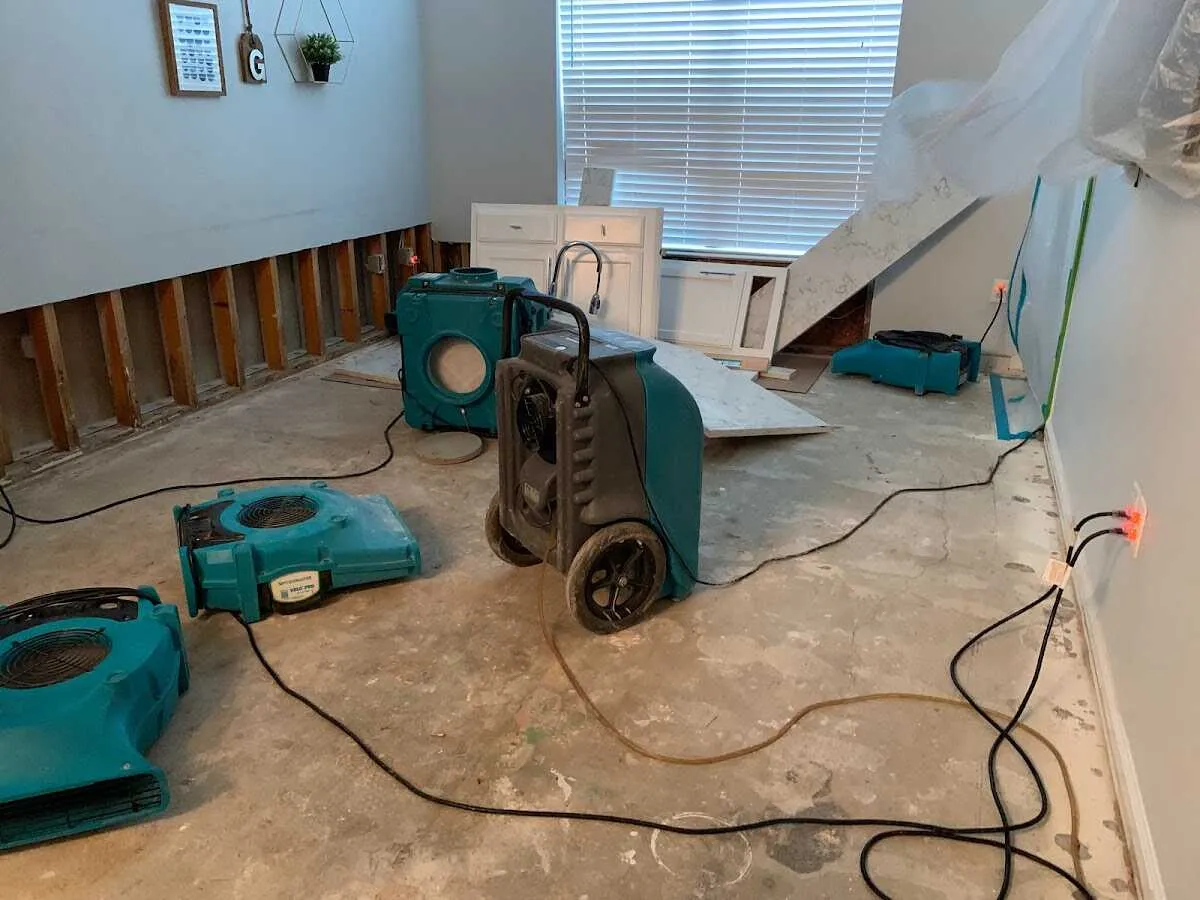 Dehumidifier in flood-cut room for Water Damage Restoration in Commerce